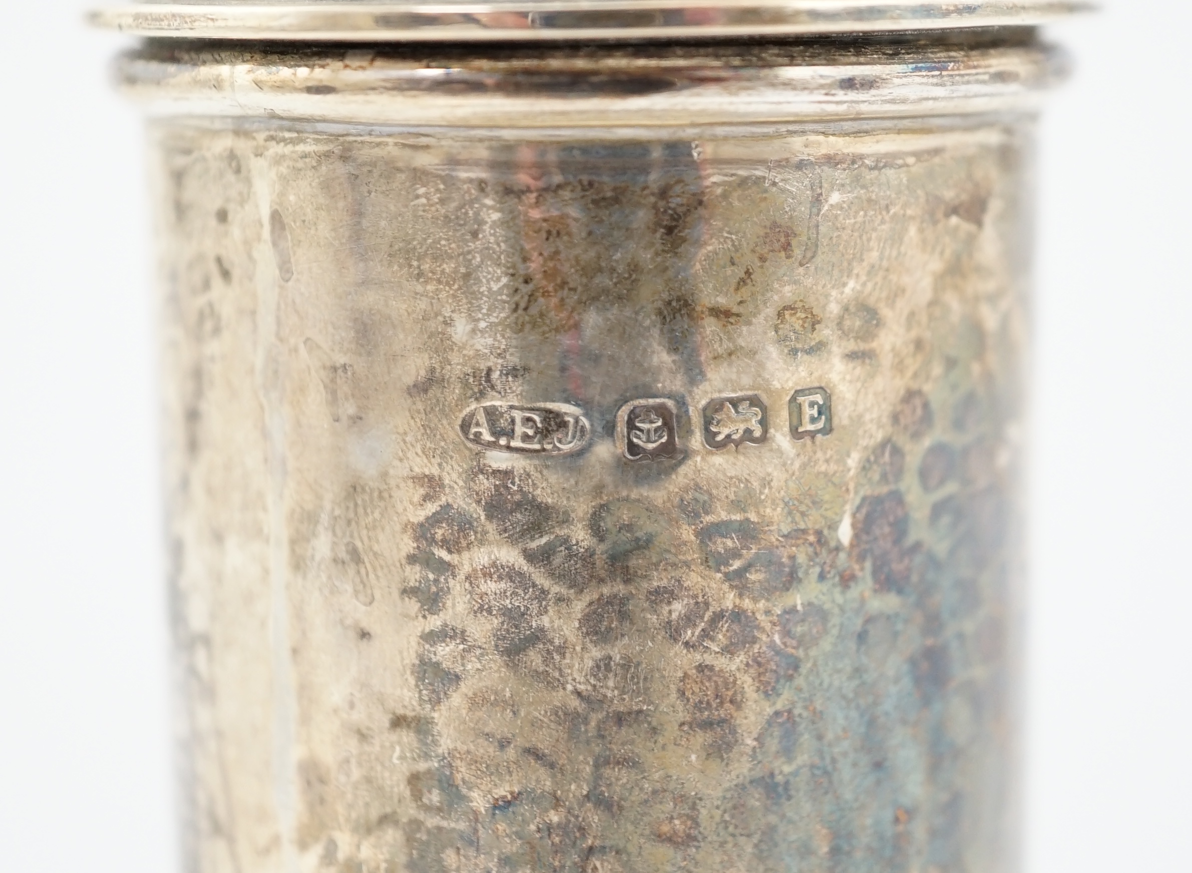 A George V Arts & Crafts planished silver sugar castor by Albert Edward Jones, of lighthouse form, Birmingham, 1929, 16.7cm, 5.3oz. Condition - fair to good